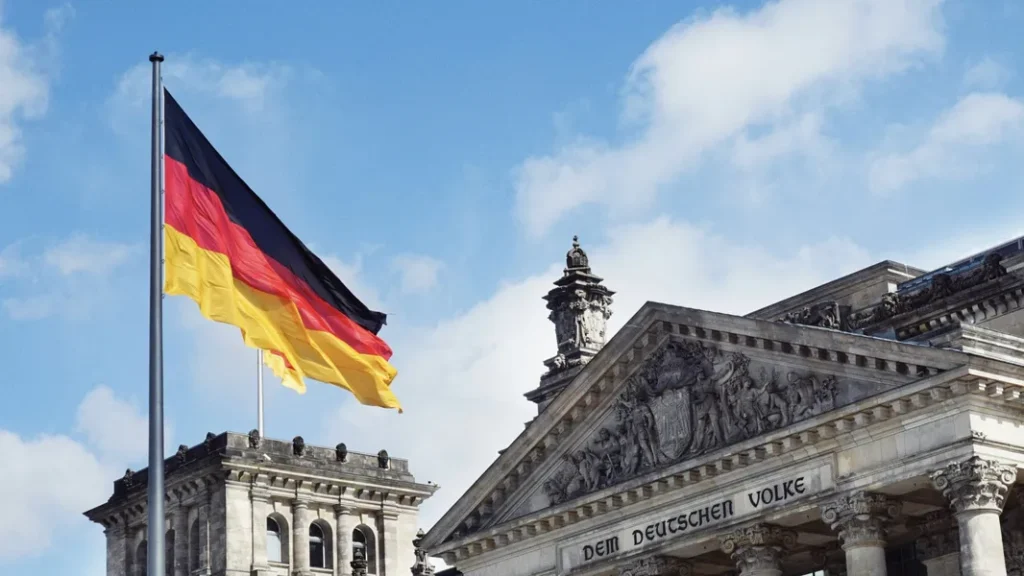 The German Flag flying over a government building
